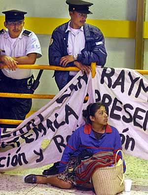 At the airport in Guatemala City on Feb. 24, Thelma Davila, a mother of five school-age children, shows her support for the month-long teachers' strike. She was ready to spend the night at the airport next to the barricade put up by police. RAUL RUBIERA/HERALD STAFF
